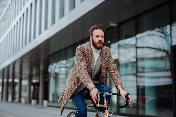 Businessman Pedals Through The City On A Crisp Morning
