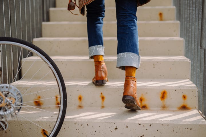 A Businessman's Confident Steps On Urban Staircase