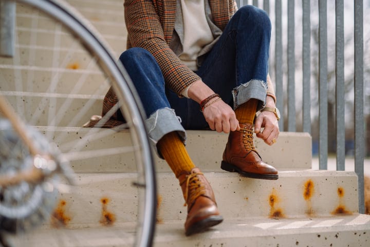 A Businessman Laces Up For A Day In The City
