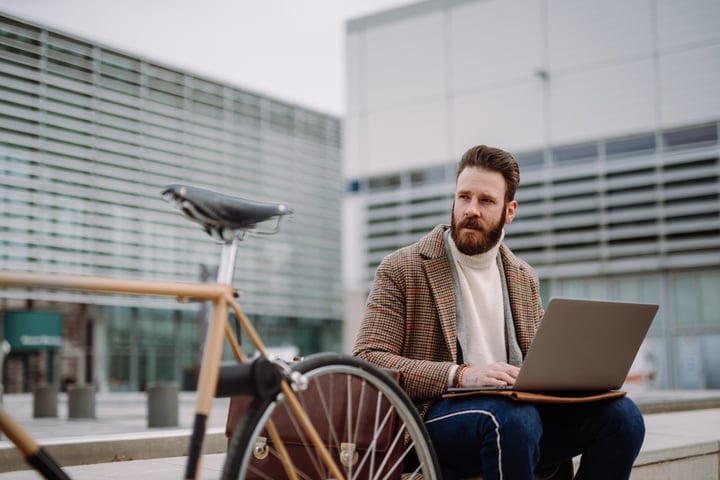 Modern Businessman Balances Work and Leisure Outdoors
