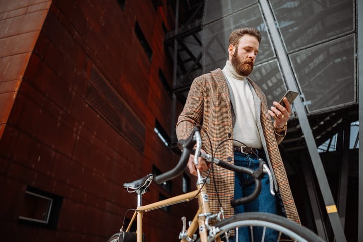 Stylish Businessman Navigates Urban Streets With Bicycle