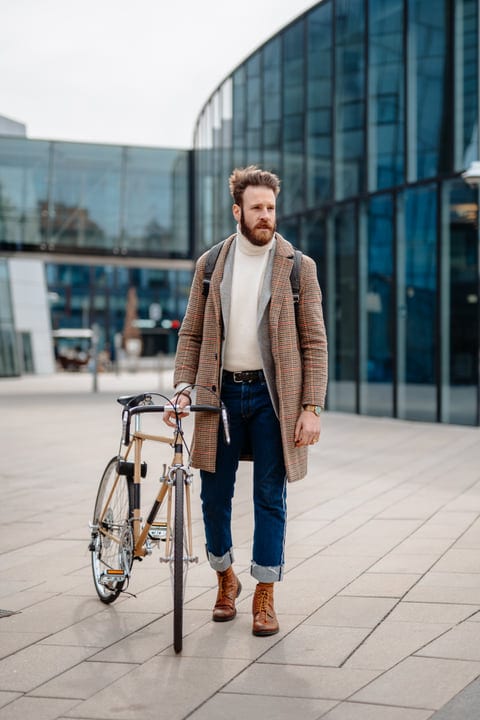 Stylish Businessman Navigates Urban Landscape With Bicycle