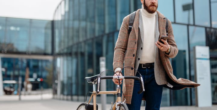 Modern Businessman Balances Urban Commute With Style