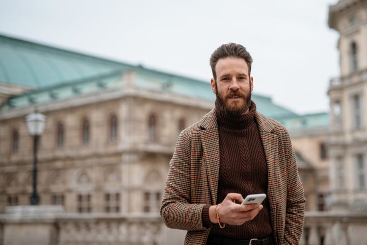 Confident Businessman Navigates Urban Streets With Style