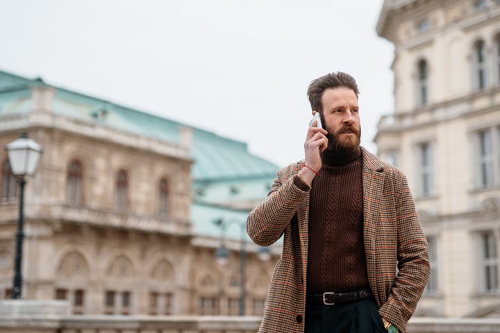 Urban Businessman Engages In A Morning Call Outdoors