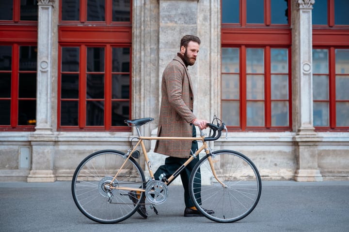 Businessman Strolls Urban Streets With Vintage Bicycle