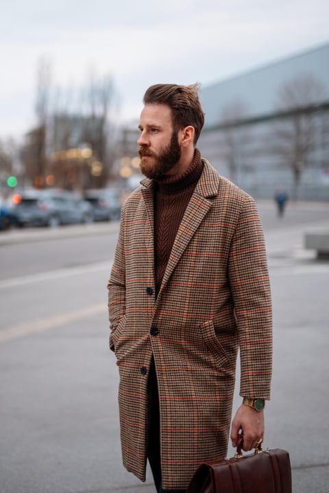 Businessman Embraces Winter in Stylish Urban Commute