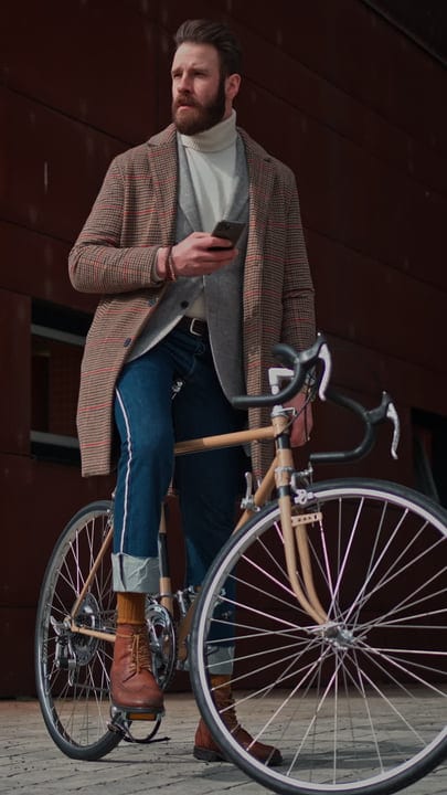 Urban Businessman Pauses On Bicycle With Smartphone