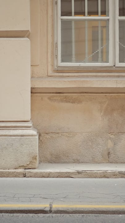 Empty Sidewalk Against a Classic European Facade