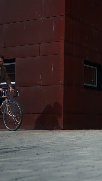 Cyclist Navigating the City on a Crisp Morning Commute