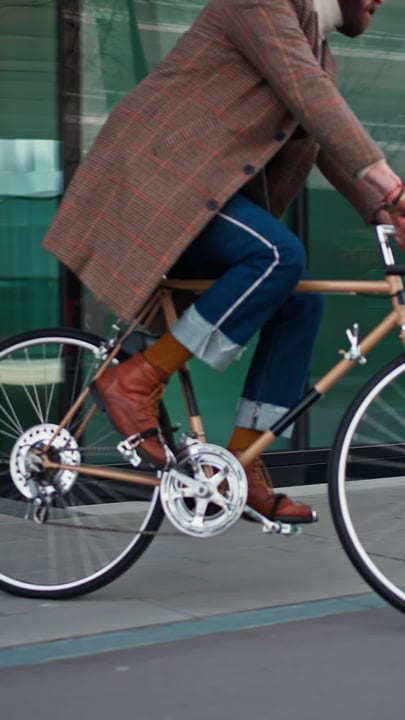 Businessman Cycling Through the Urban Landscape in Style