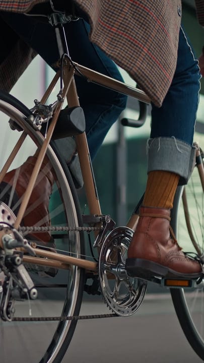City Commute: Businessman Pedals Through Urban Streets
