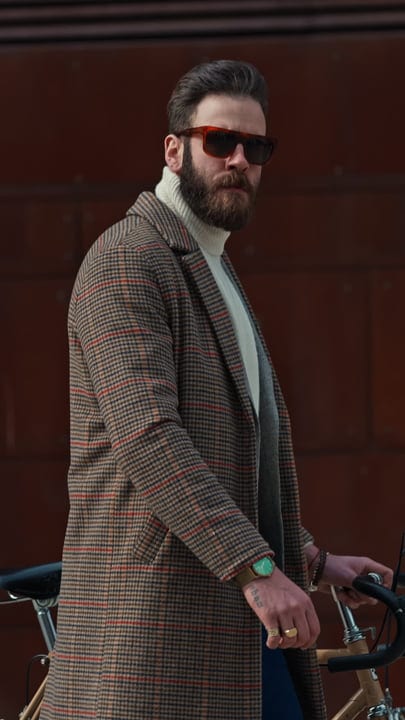 Dapper Businessman Cycling Through the Autumn Streets