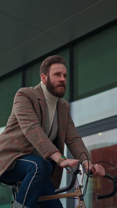 Urban Businessman Cycling Through City Streets In Style