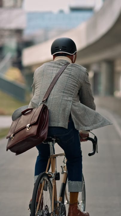 Cyclist Businessman Navigates The Urban Jungle On Two Wheels