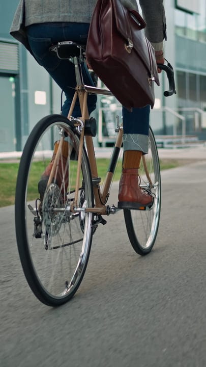 Businessman Pedals Through City Streets With Purpose