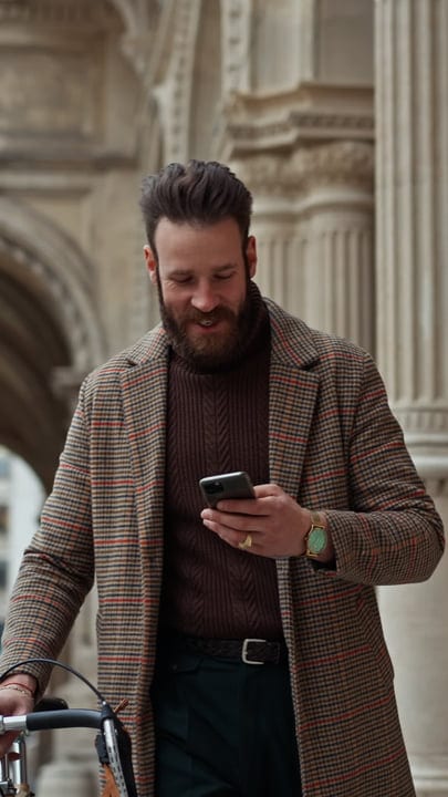 Chic Businessman Checks His Phone On Autumn Day