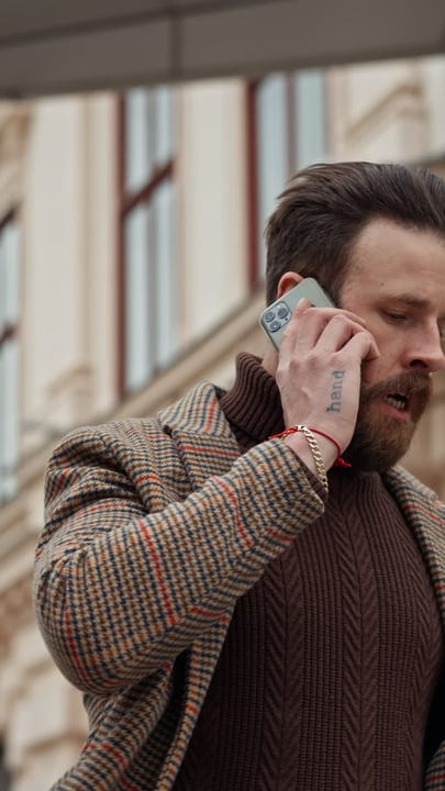 A Businessman Takes A Call Amid The Urban Rush