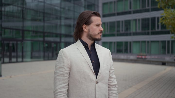 Confident Businessman Strolling Through Modern Cityscape