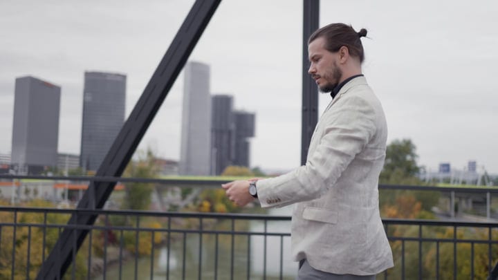 Modern Businessman Reflects During Urban Bridge Walk
