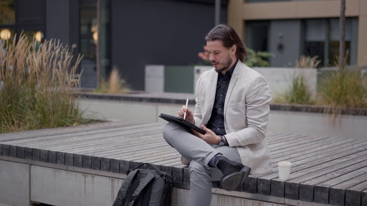 Urban Professional Reflects on a Modern City Bench