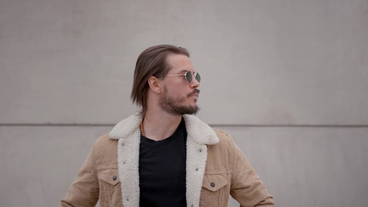 Confident Businessman Embraces Urban Style in Autumn Jacket