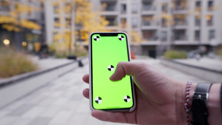 Checking Messages On A Smartphone During An Autumn Walk