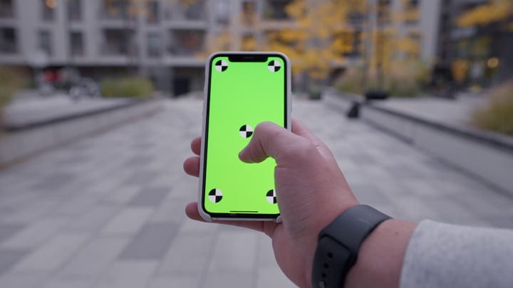 Modern Businessman Navigates Technology On City Walk