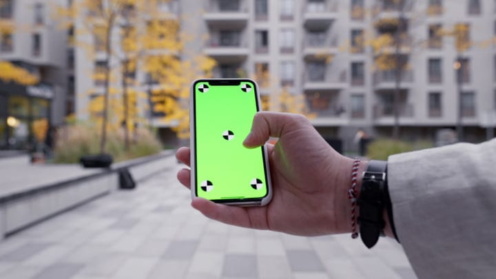 A Businessman Checks His Phone Amid Urban Autumn Vibes