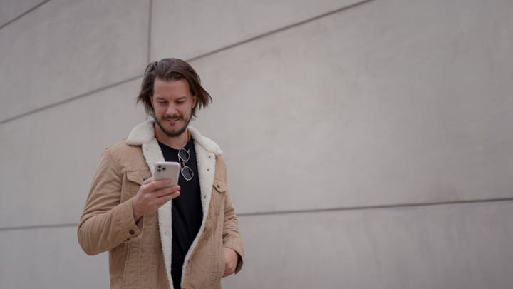 Casual Stroll With A Smartphone In Autumn Attire