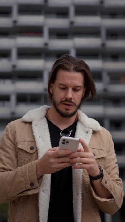 Modern Businessman Engaged With Smartphone Outdoors