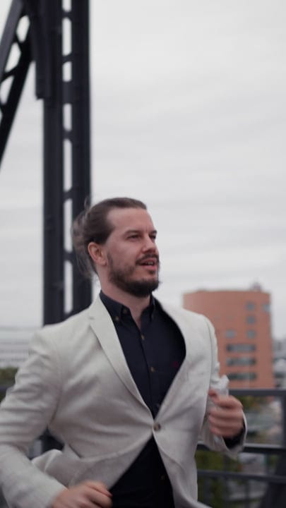 Businessman Strides Confidently Through Urban Landscape