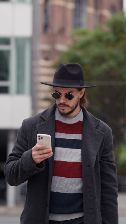 Sophisticated Stroll: Businessman Navigates The City Streets