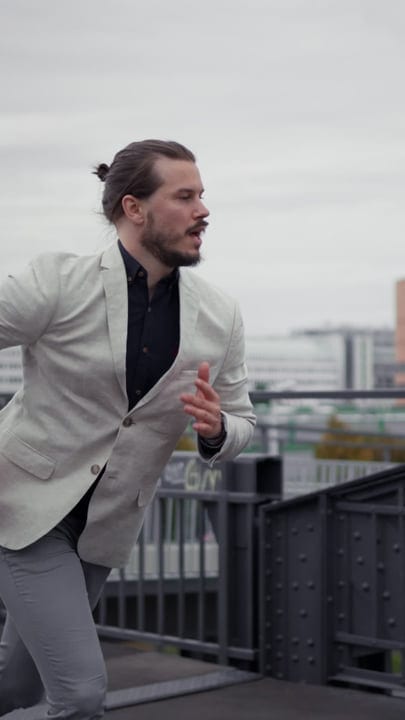 Dynamic Businessman Navigates the City Streets With Determination