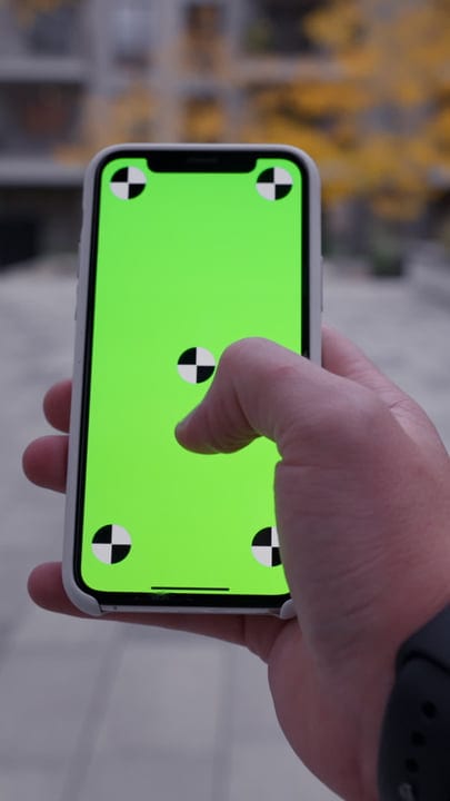 Businessman Navigates City Streets Through His Smartphone