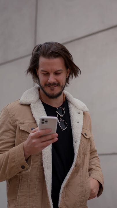 Young Professional Enjoys A Digital Moment In The City